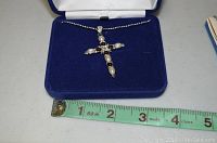 Camrose & Kross necklace with cross pendant on measuring tape showing length about 21 inches, in blue velvet box with white satin top lining.