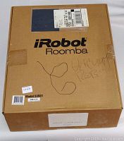 Exterior of sealed cardboard box labelled iRobot Roomba Model 53501