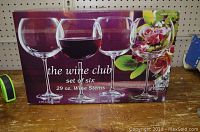 Box of the set of six large crystal wine glasses showing the brand 'the wine club' and size 29 oz.