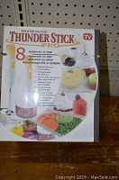 Front box image of Thunder Stick Pro showing product name and 8-in-1 appliance features.