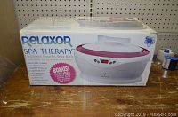 Box front showing the product and branding Relaxor Spa Therapy Electronic Paraffin Wax Bath.