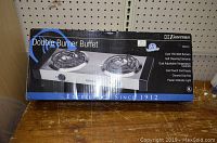 Emerson Double Burner Buffet electric cooktop in original boxed packaging showing front image of product and brand name.