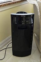Full front view of black Bionaire humidifier unit, showing overall size and shape.