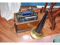 Overall view of wooden-base phonograph with mechanism and detached horn
