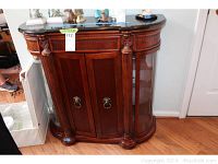 Full front view of Bombay Varese console showing wood finish, doors, base and signage.