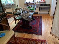 Full view of the rug under a table showing overall design and color