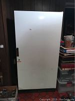Full front view of white Kenmore frostless freezer with handle and lock