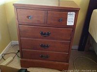 Front view of wooden nightstand showing the single top drawer with black knob handle and two shelves below. Shows mark 466 on right top corner.