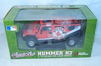 Boxed red Hummer H2 1:18 die-cast model car with Boston Red Sox logo and branding visible through clear plastic window of box.