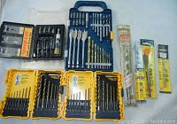 Overview of the drill bit and driver sets including yellow DeWalt cases, blue case with various bits, Speed-Lok set, and Irwin packaged bits.