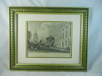 Framed engraving showing entire artwork with gold carved frame and matted border in green and gold.