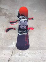 Full view of the Lamar Mecha snowboard showing design and bindings.