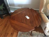 Overhead view of tri corner wood table showing top surface and shape