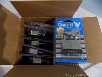 Box containing six new Champion laminated steel padlocks in individual blister packages with keys