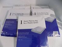 Five new queen size mattress bags stacked together in original packaging, labeled 60" by 16" by 94"