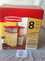 Front of box showing Rubbermaid 8 piece modular canister set with lids.