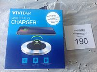 Product box for Vivitar Wireless QI Charger with specifications and compatible devices listed.