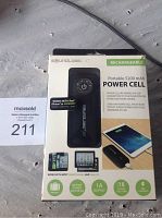 Photo of SoundLogic XT Portable 5200mAh Power Cell in its original retail packaging, showing product image, specifications, and compatibility details.