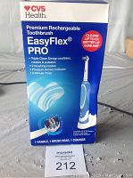 Photo of the product box front showing branding, features like triple clean design, and included contents