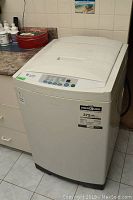 Front and top of the portable washer showing overall exterior condition