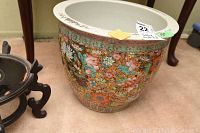 Front view of wide-mouthed oriental vase showing detailed floral pattern and colorful design with 15 inch diameter tag.