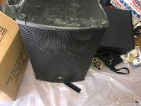 Front view of Eurolite B1520 Pro floor monitor speaker showing black metal grille and wear on casing.