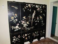 Full view of the four-panel Asian screen showing the stone inlaid flowers and birds on black background with decorative gold accents.