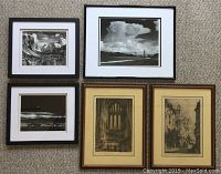 Group shot of all five framed prints laid on carpet