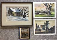 Framed watercolor of a desolate house with snow, two unframed landscape prints, and small framed oil painting of Dutch harbor scene