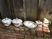 Group shot of all five pieces on brick ledge