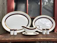 All pieces on wooden bench against window