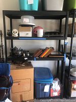 Full view of larger metal shelf unit with various items stored on it (not included).