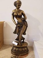 Full front view of statue on pedestal