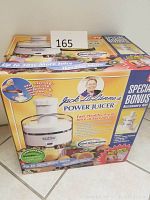 Boxed Jack LaLanne Power Juicer showing front labeled features and bonus accessory kit