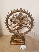 Front view of large bronze Shiva Nataraja sculpture showing detailed pose and flame halo