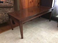Full side view of rectangular Mersman wood coffee table showing polished surface and tapered legs
