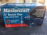 Original box of Mastercraft 5-inch bench vise with swivel base, showing branding and product details.