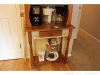 Mr. Coffee 4-cup coffee maker on wooden kitchen shelf with Gevalia pot and canister below