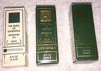 Three boxed bottles of Aromatique perfume oils The Smell Of Gardenia, The Smell Of The Tree, and The Smell Of The Rain, showing branding and volume