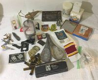 Overview image of entire lot showing all items together on white cloth surface.