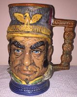 Front view of the vintage ceramic face stein showing the detailed German soldier's face, colorful hand-painted features, and sculpted hat and handle.