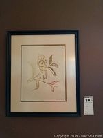 Full view of framed indigenous art print on wall