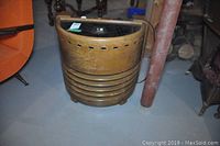 Front view showing semi-circular wood cabinet with horizontal grille slats