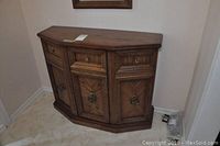 Wooden front hall table showing front view with drawers and cabinet doors