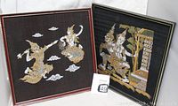 Two framed decorative wall art pieces featuring Hindu Gods with gold and colorful details on dark backgrounds.