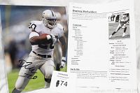 Color photo of Darren McFadden in Oakland Raiders uniform, autographed, displayed with printed biography sheet.