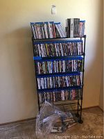 Full view of black metal storage rack loaded with discs