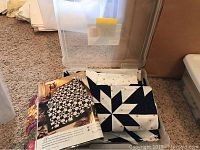 Quilt top blocks and open pattern book showing star design