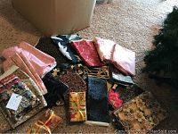 Overview of multiple fabric pieces showing variety in pattern and color spread on floor