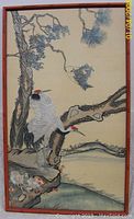 Full view of large framed antique Chinese embroidery depicting two cranes on a pine tree branch with natural scenery. Non-glare glass and wooden frame visible.